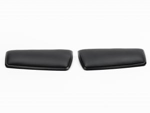 Black ergonomic armrest pads on a white background, designed for optimal comfort and office use.