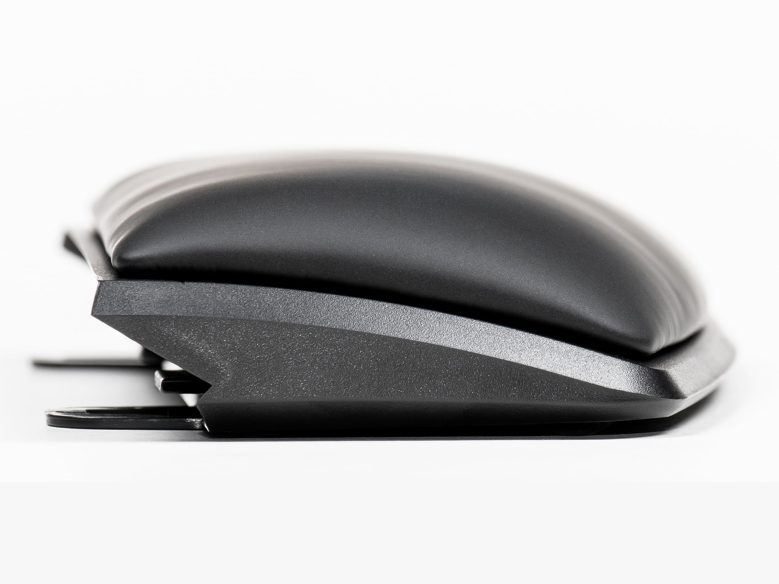Ergonomic black wrist rest profile view, ideal for office and gaming keyboards, enhancing comfort and support.