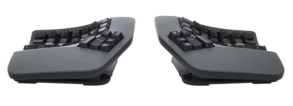 Ergonomic split keyboard on a desk, enhanced for comfort and adjustable typing position. Ideal for office setups.
