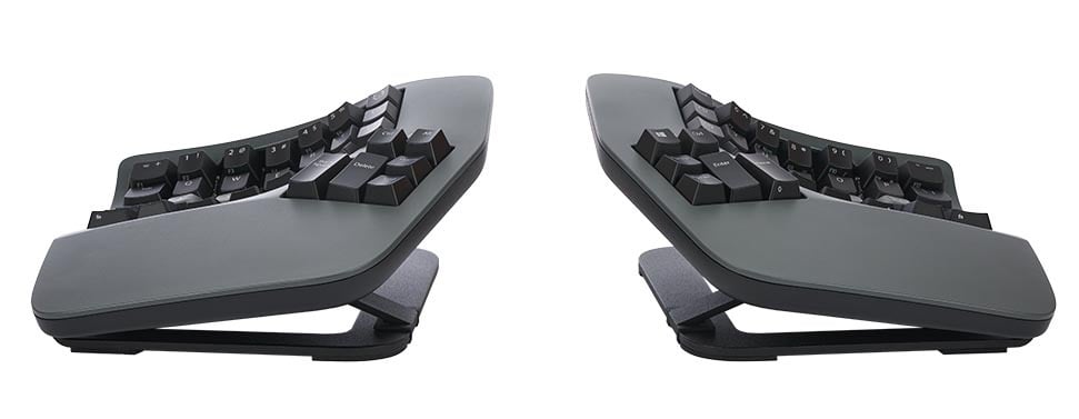 Ergonomic split keyboard on a desk, enhanced for comfort and adjustable typing position. Ideal for office setups.