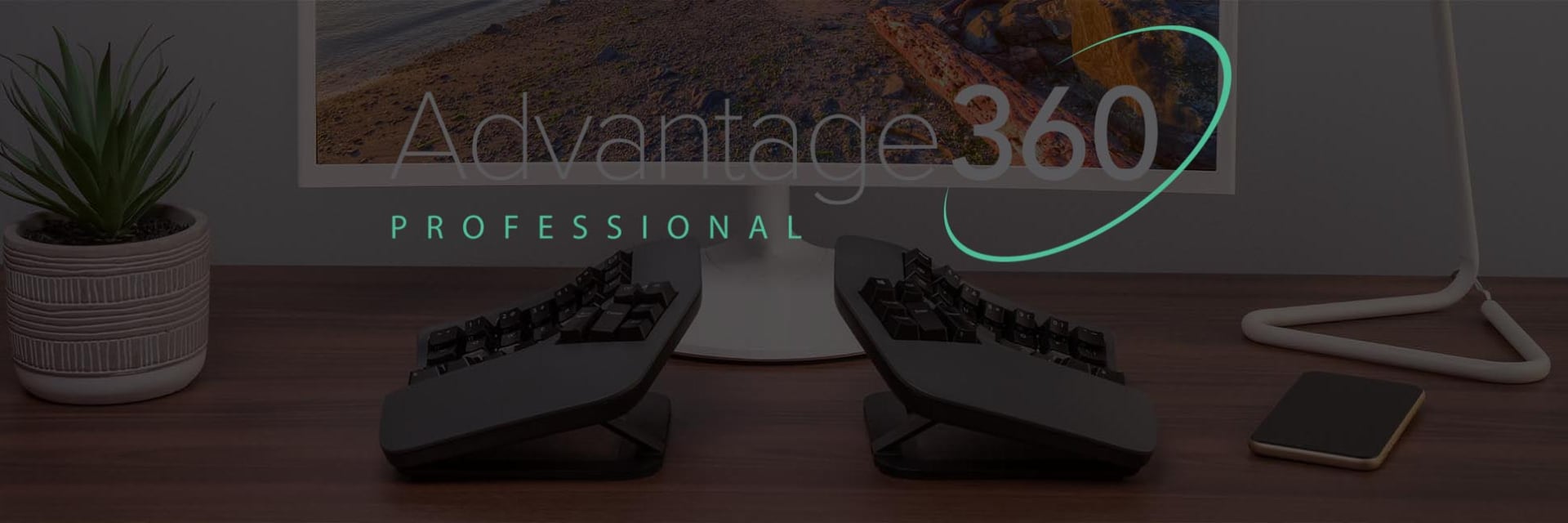 Kinesis Advantage 360 PRO Ergonomic split keyboard setup with Advantage 360 Professional branding on a sleek office desk.