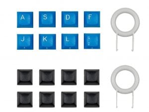 Blue and black control panel buttons with embossed labels, accompanied by two circular white components.