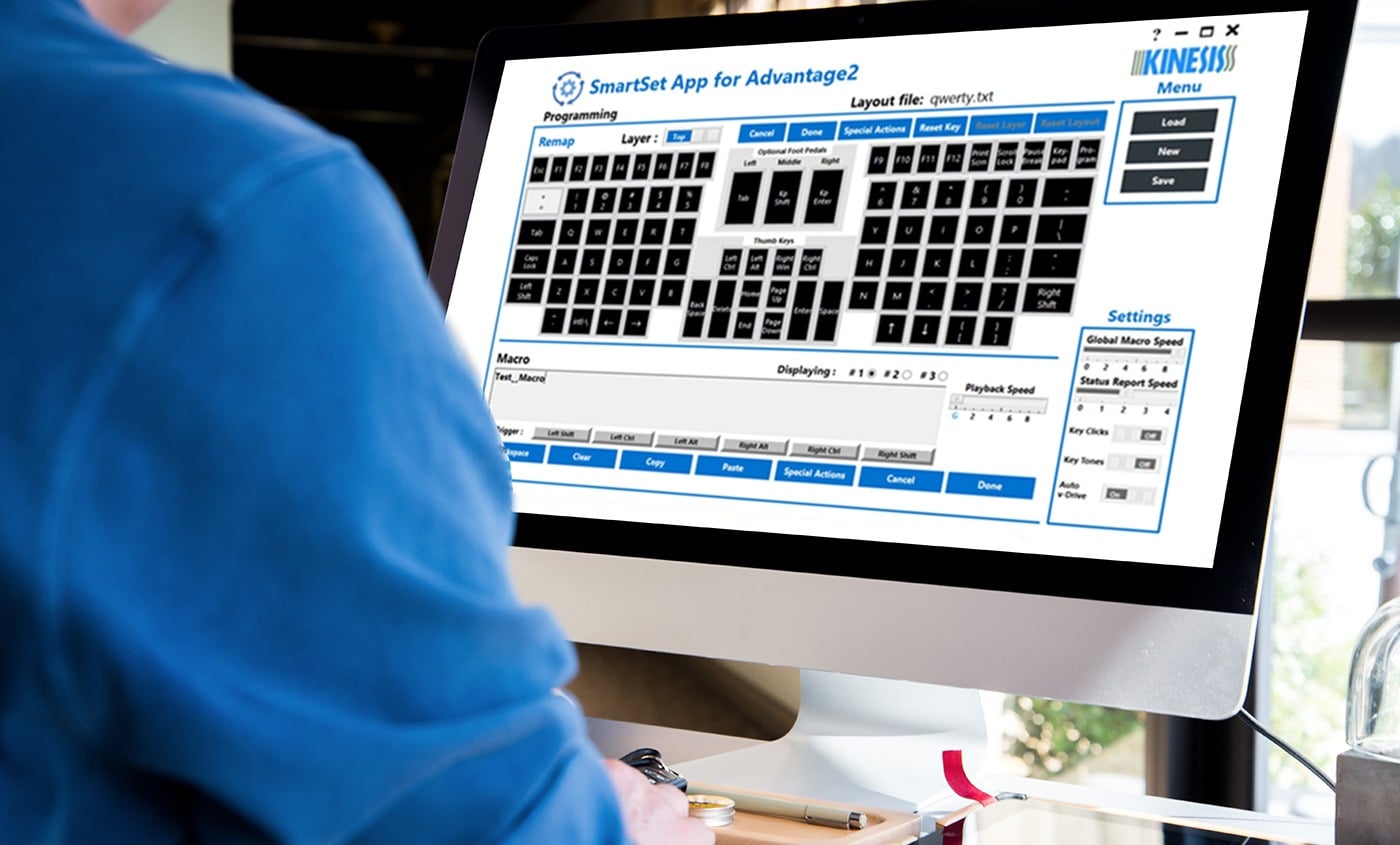 Person using SmartSet App for keyboard customization on a computer screen, enhancing typing efficiency.