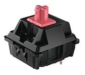 Mechanical keyboard switch with red stem for gaming and typing efficiency.