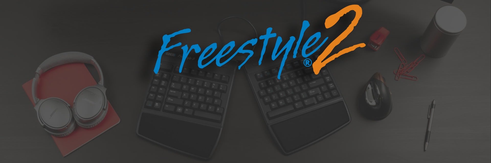 Freestyle2 USB Getting Started Freestyle2 ergonomic keyboard, headphones, and office items on desk enhance work comfort and productivity.