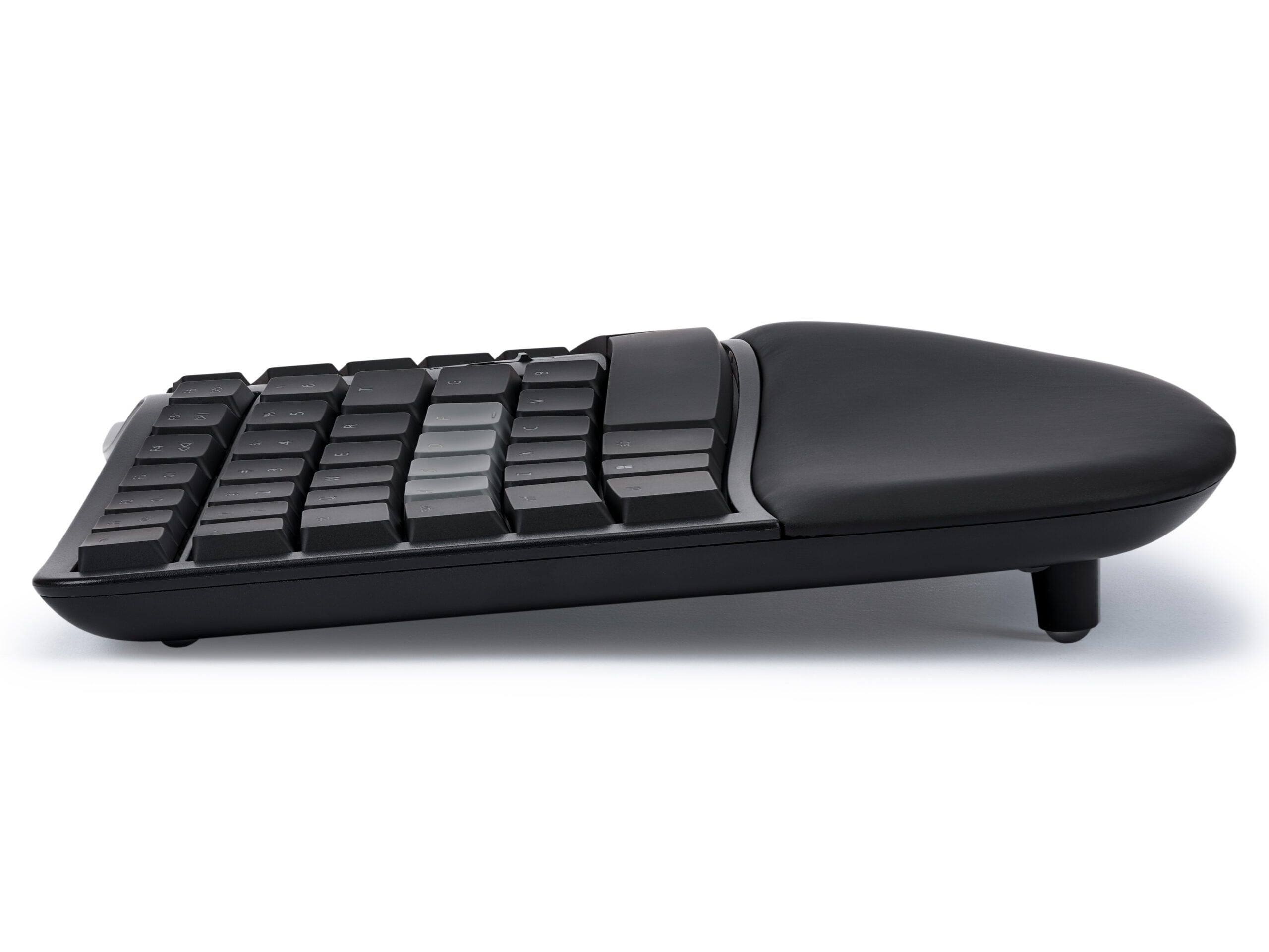 Ergonomic mechanical keyboard with cushioned wrist rest, side profile view on white background.