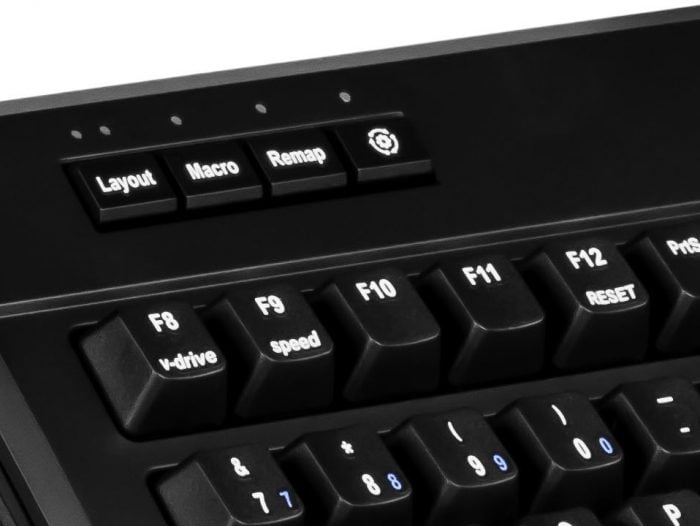 Close-up of a black keyboard featuring function keys and buttons for layout, macro, and remap settings.