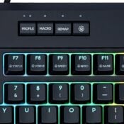 RGB gaming keyboard close-up with profile, macro, and remap buttons for customizable controls.