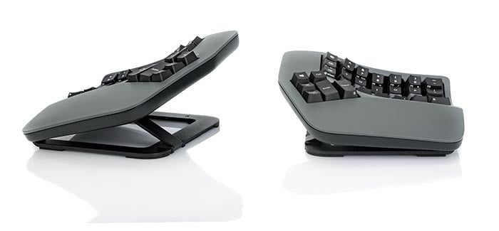 Ergonomic split mechanical keyboard angled for comfort, side view on white background.
