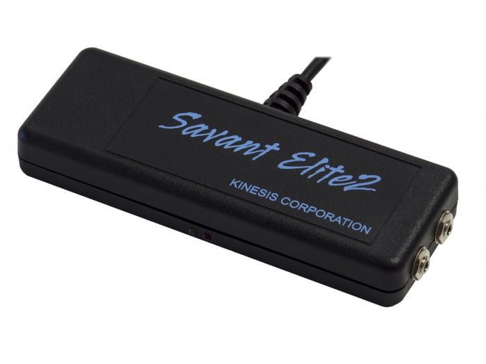 Close-up of a black Savant Elite2 foot pedal by Kinesis Corporation with cable and dual inputs, isolated on white.
