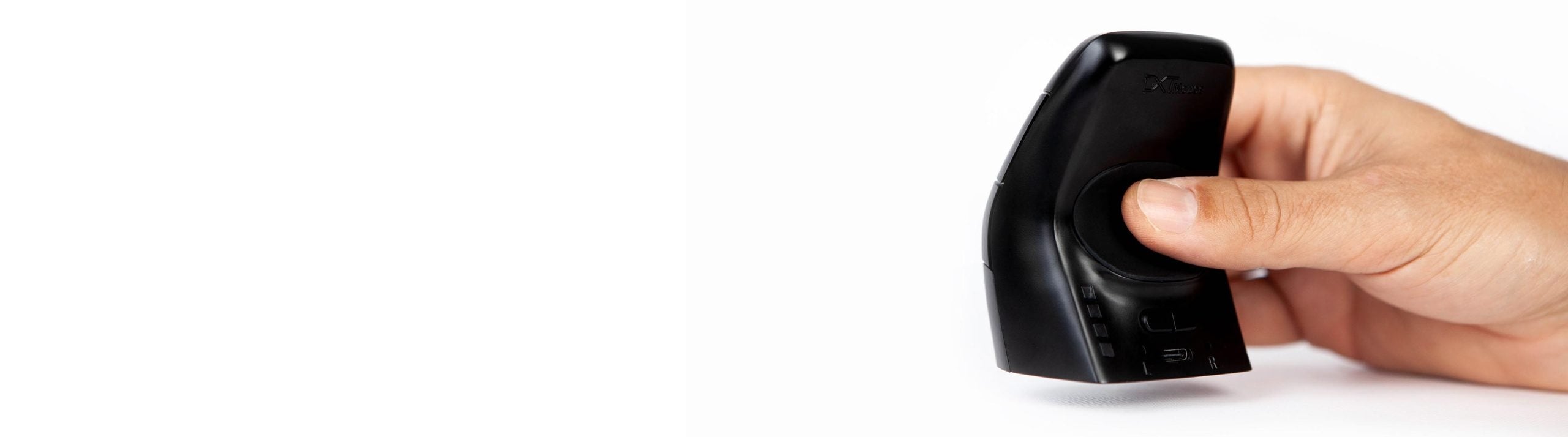 Hand holding a small black ergonomic device on a white background, showcasing a compact design and user-friendly grip.