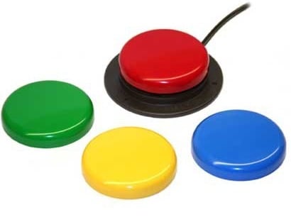 Colorful round buttons in red, blue, green, and yellow on white background, with a cable attached to the red button.