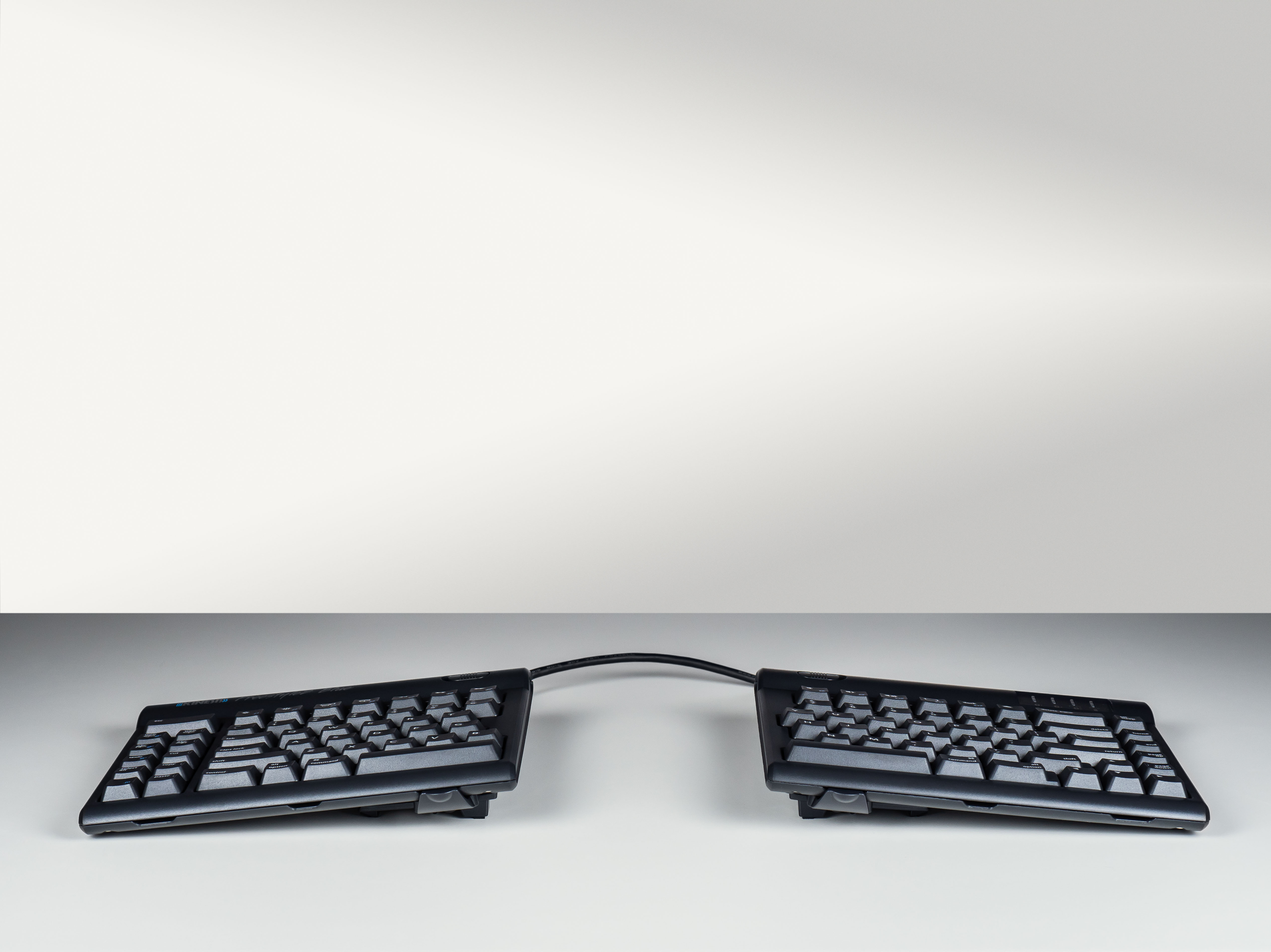 Ergonomic split keyboard on a modern desk, enhancing comfort and productivity.