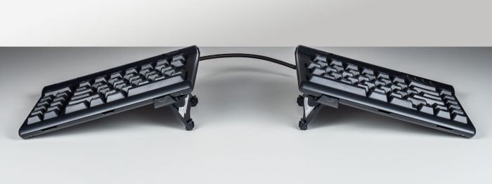 Split ergonomic keyboard with tented design for comfortable typing.