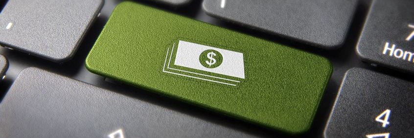 Green keyboard key with dollar bills icon, symbolizing online financial transactions or e-commerce.