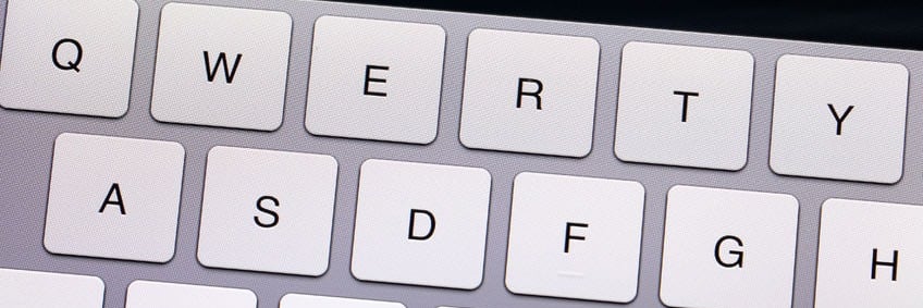 Close-up of a QWERTY keyboard, featuring the top two rows of keys for efficient typing.